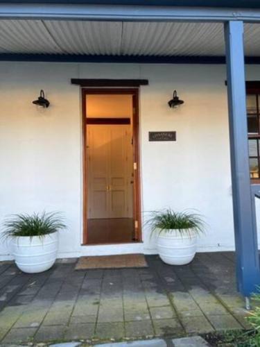 Grange House | Two roomed private suite in front of cottage