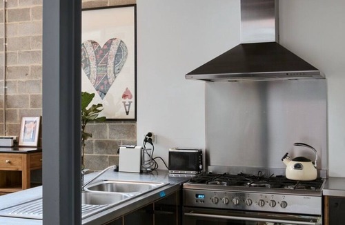 Brunswick Apartment | Bottega Loft Industrial Charm with Artistic Flair