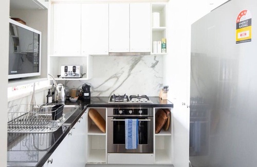 East Melbourne Apartment | Chanel: Unwind in the heart of Wellington Gardens.