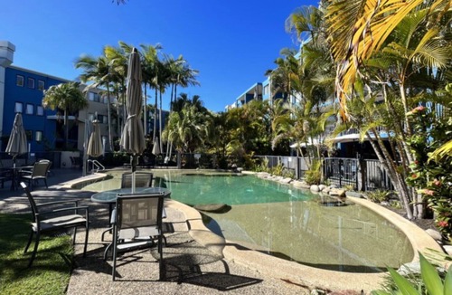Dicky Beach Apartment | Coastal 2-bedroom apartment at Portobello by the Sea, Dicky Beach. Enjoy ocean glimpses, resort pool, and BBQ area. Sleeps 4 comfortably. Steps from surf, cafes, and shops. Perfect for a relaxing Sunshine Coast holiday.
