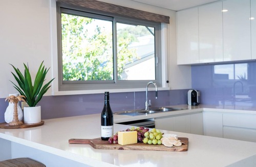 Hyams Beach House | Entice: Panoramic beachfront views. Sunrise views over the ocean at Hyams Beach