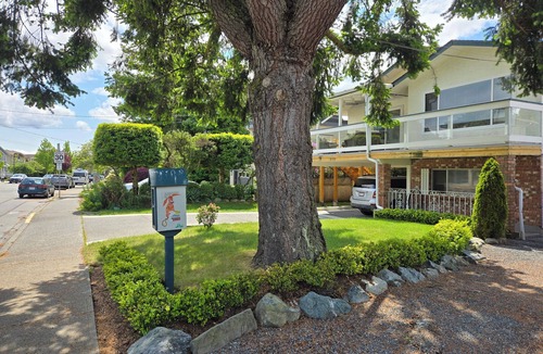 Booktown Apartment | Fully furnished garden suite one block from downtown, ocean in charming Sidney
