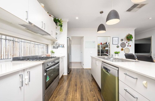 Clyde North House | Modern Family Retreat Home with Sunroom