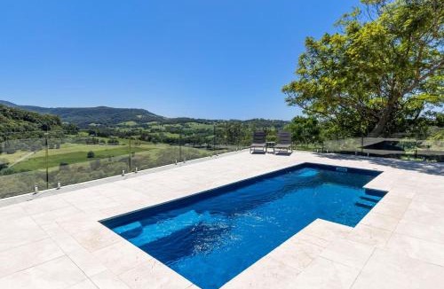 Broughton Village House | Moonraker - Fireplace with Swimming Pool