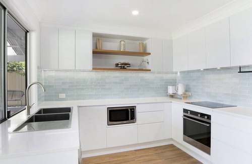 Berkeley Vale House | Poolside Family Retreat by HolidayCo.
