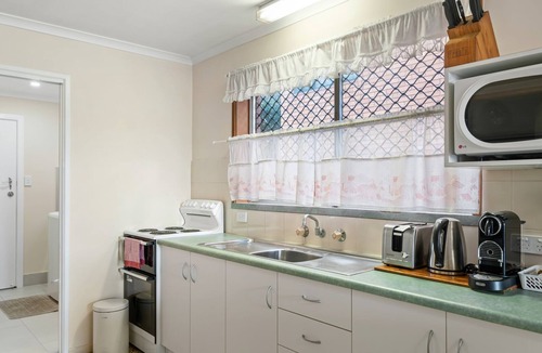 South Evans Head Apartment | Retro 1BR riverfront apartment with backyard, BBQ, and easy access to water activities