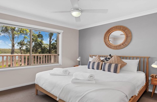 Culburra Beach House | Sandy C - immaculate modern home with outdoor spa and stunning lake views.