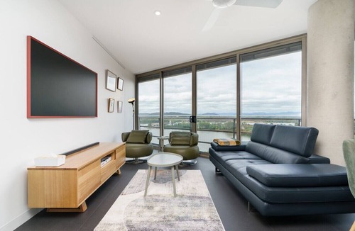 City West Apartment | Stylish Top-Floor Apt with Lake and Mountain Views