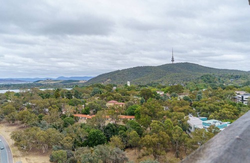 City West Apartment | Stylish Top-Floor Apt with Lake and Mountain Views