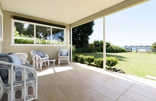 Clarence Point House | Sunset Sanctuary: Waterfront Home with Balcony and Patio