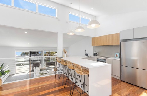 Corlette House | Sunset Views and Spa Nights – Lux Home Steps to the Beach