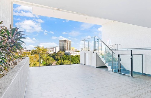 Darwin City Centre Apartment | The Smith A Vibrant Poolside Balcony Haven