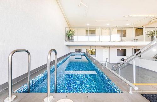 Darwin City Centre Apartment | 'The Smith' A Vibrant Poolside Balcony Haven