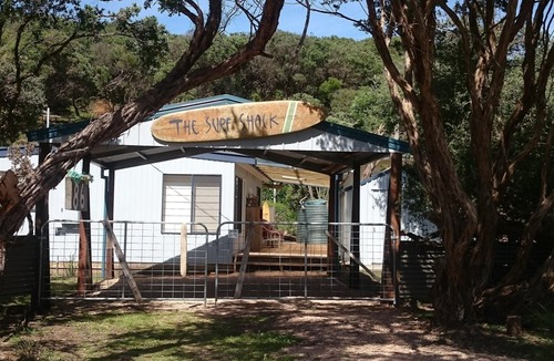 Sandy Point House | The Surf Shack is a short walk to the beautiful beach for relaxation or surfing.
