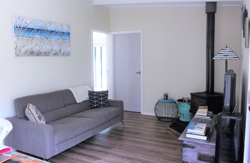 Sandy Point House | The Surf Shack is a short walk to the beautiful beach for relaxation or surfing.