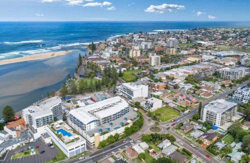 The Entrance Apartment | Waterfront, Pool, Balcony, Prime Location