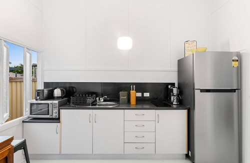 Newell House | White & Black Cockatoo by the Sea
