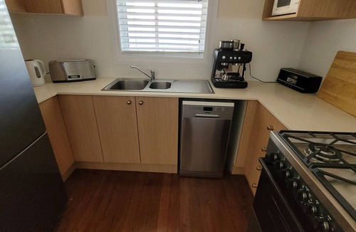Port Macquarie House | Whole House WiFi Sundecks. Walk to Flynn's Beach + Dining. Family + Dog Friendly