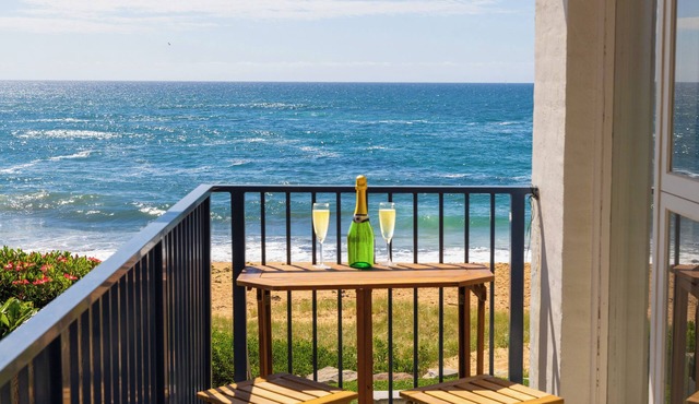 Family friendly - beachfront apartment - steps to the sand- private parking