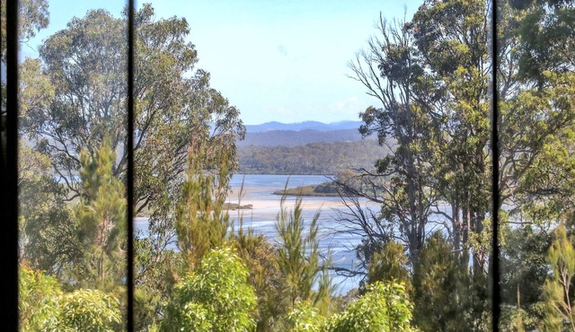 Set among the trees with lake views & just moments from Merimbula's beaches