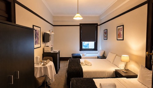 Quadruple Room (1 Queen and 2 Single) with Shared Bathroom
