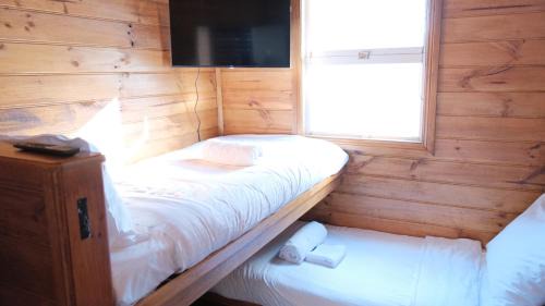 Small L-Shaped Bunk Room with Shared Bathroom